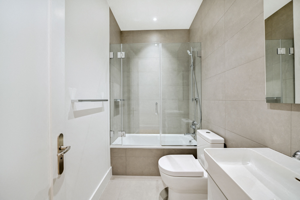 a bathroom with a sink toilet and a shower